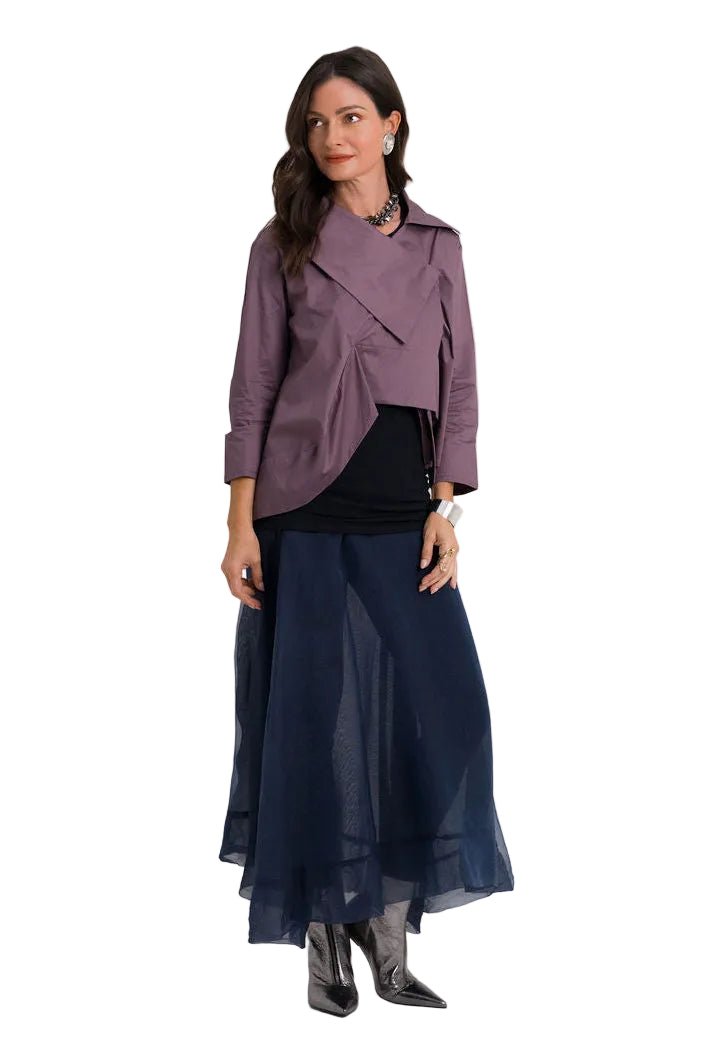 A woman modeling a 100% cotton mauve wrap-style jacket and a dark navy maxi skirt, standing against a plain light gray studio background.