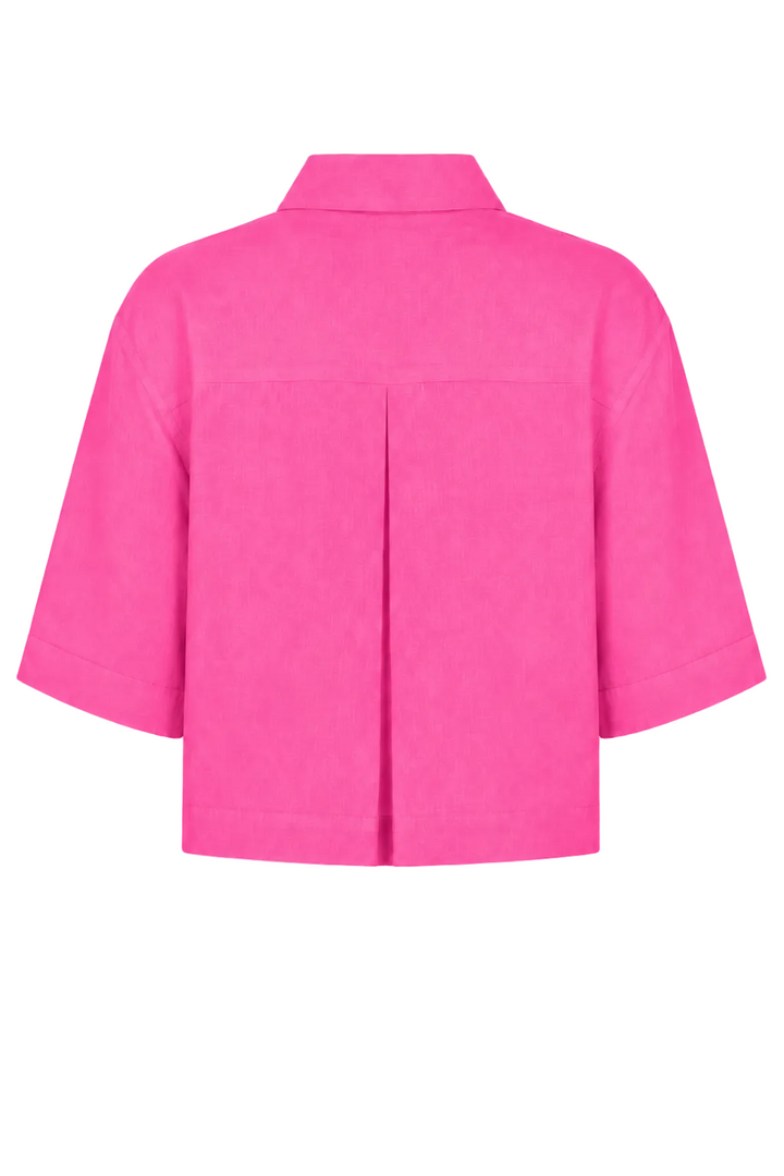 Bright pink short-sleeve 100% linen cropped shirt with a pointed collar and front pleat detail, shown from the back on a white background.