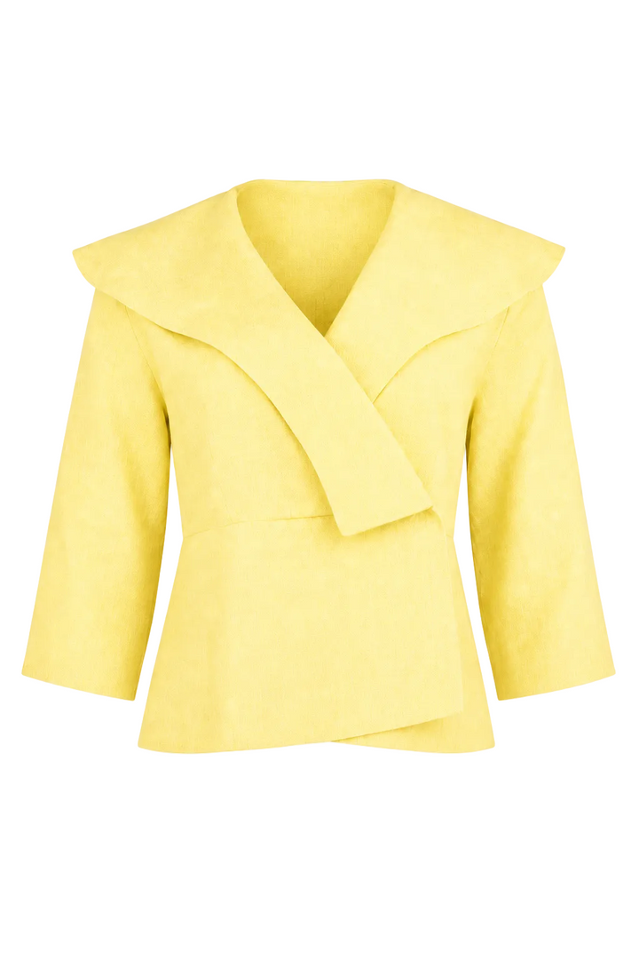 A 100% linen light yellow wrap-style jacket with a wide collar and long sleeves, shown against a plain white background.