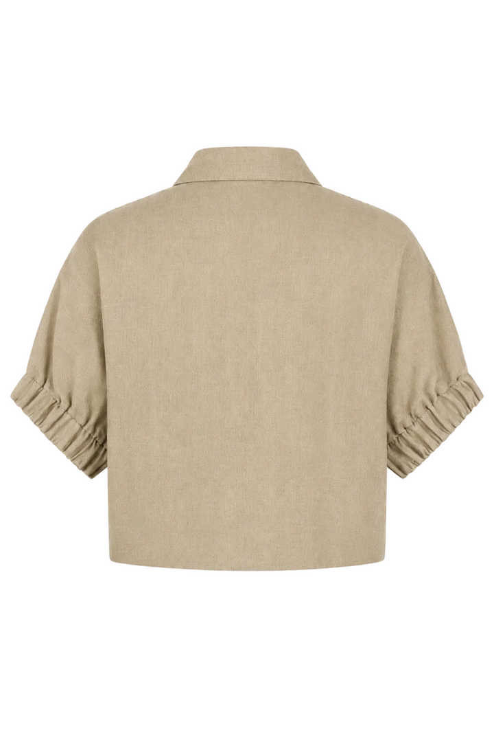 A beige short-sleeve cropped shirt jacket with gathered, pleated sleeves, shown from the back on a white background.