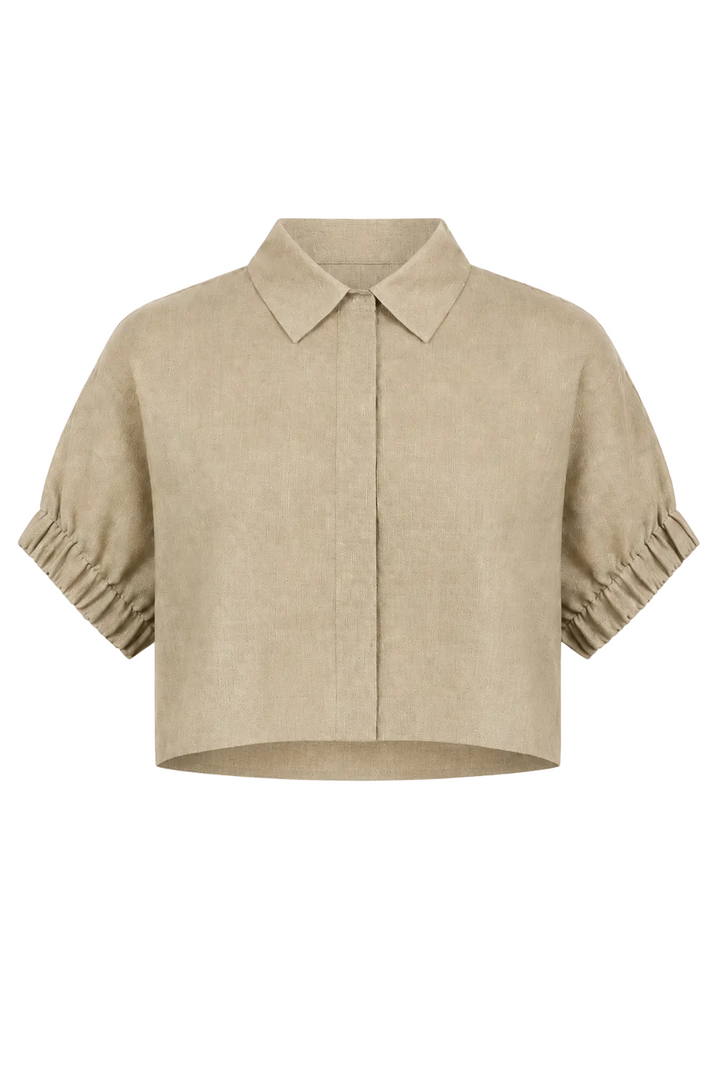 A cropped beige linen shirt jacket with a pointed collar, short sleeves featuring gathered ruffle cuffs, and a front button closure, shown against a plain white background.