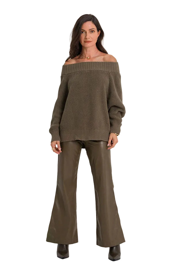 A woman modeling a matching two-piece knit set consisting of an off-the-shoulder long-sleeve sweater and wide-leg pants in a solid olive green color, set against a plain white studio background.