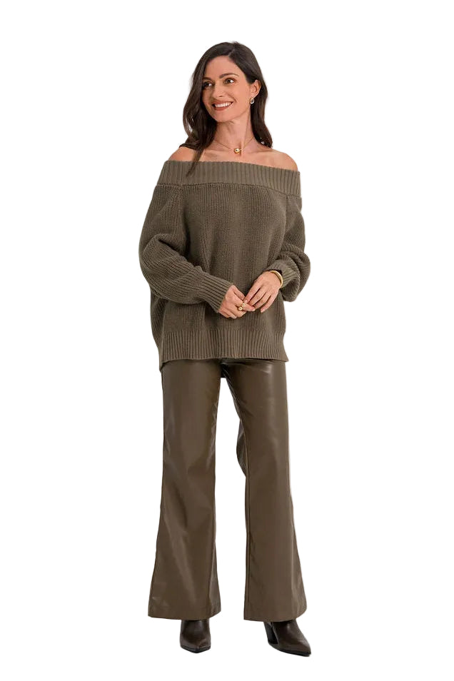 A woman modeling an olive green off-the-shoulder knit sweater and matching wide-leg pants against a plain white studio background.