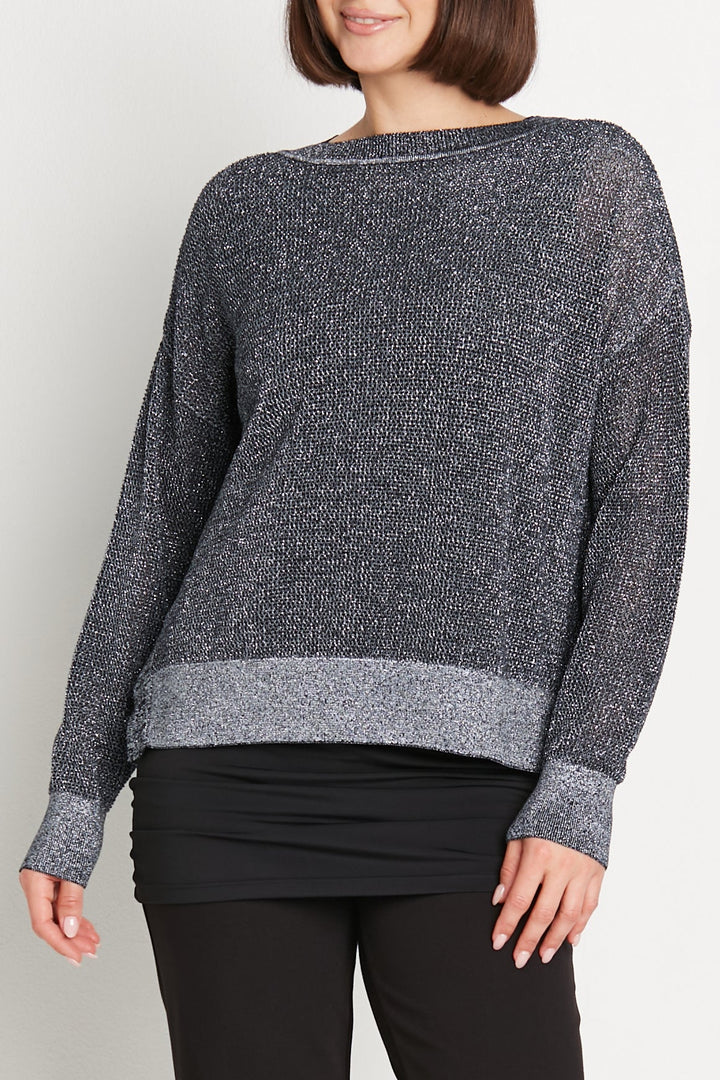 Woman wearing a light blue sweater on a white background