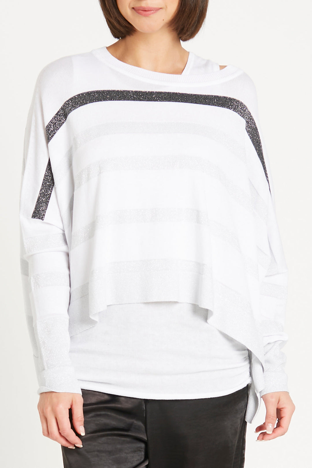 White long-sleeve top with black glittery stripe worn by a person on a white background