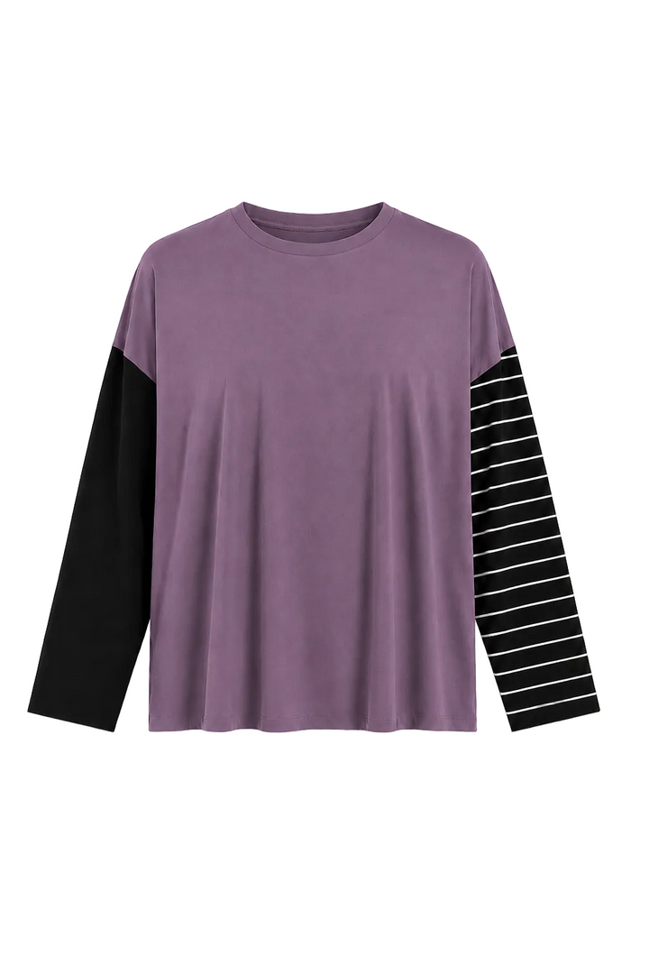 A 100% pima cottonlong-sleeve crewneck top in dusty purple, featuring solid black sleeves on one side and black and white striped sleeves on the other, displayed against a plain white background.
