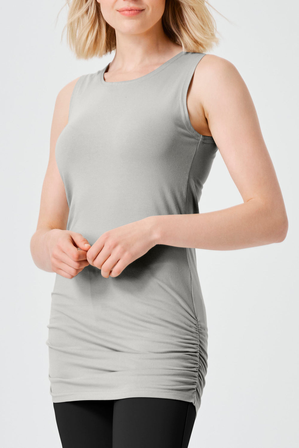 A titanium sleeveless tank top with ruched details, made of cotton lycra, being worn by a model.