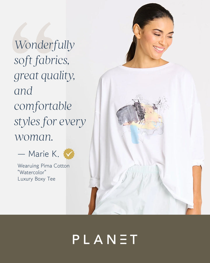 Woman wearing a white pima cotton t-shirt with a graphic design, text about soft fabrics and quality, and 'Planet' brand logo.